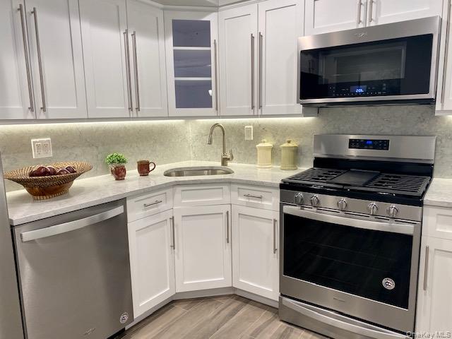 #5 photo, 65 Westwood Drive, Westbury , NY 11590