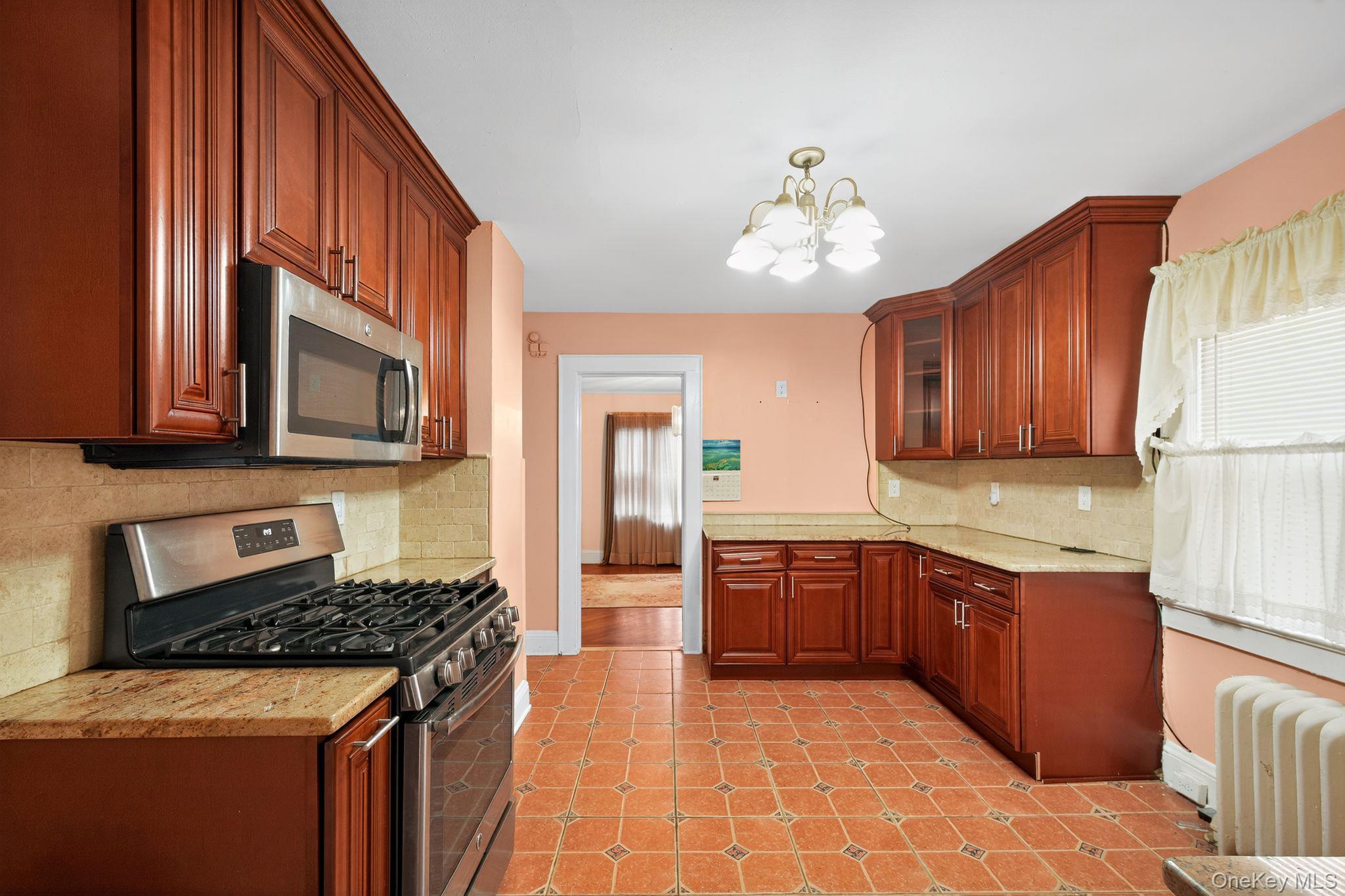 #13 photo, 82 E Clinton Avenue, Roosevelt , NY 11575