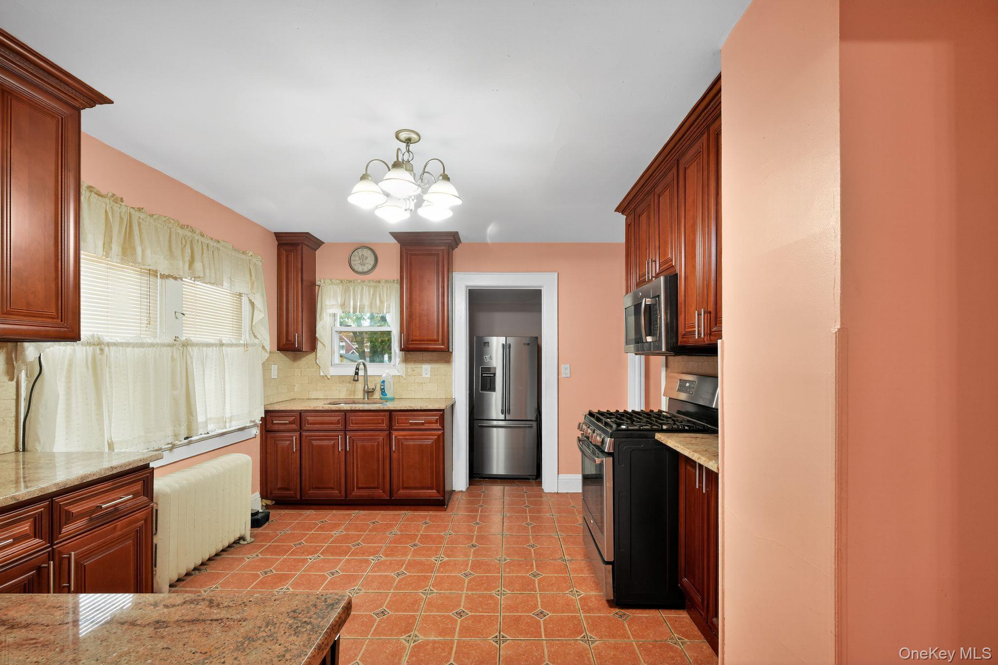 #14 photo, 82 E Clinton Avenue, Roosevelt , NY 11575