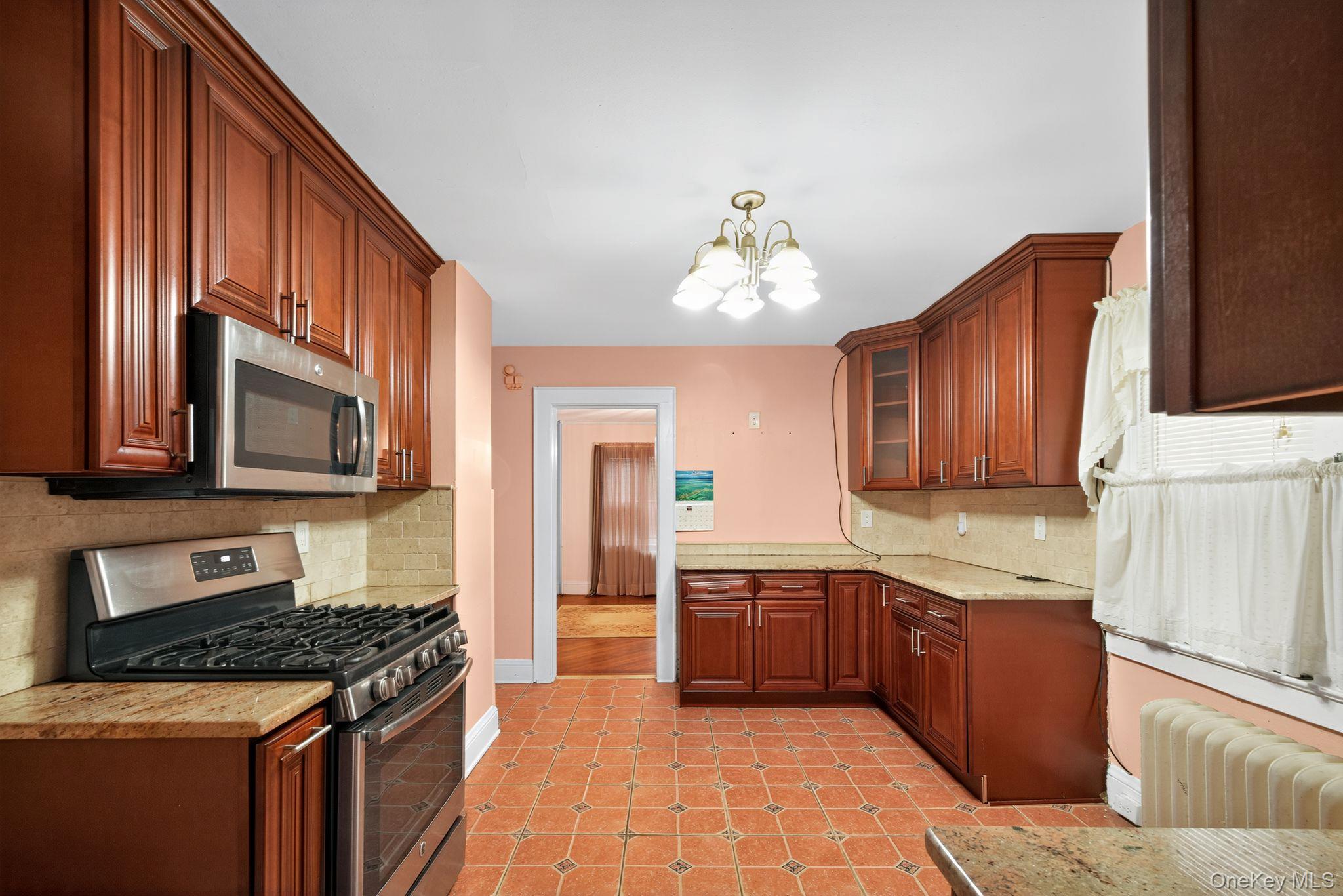 #18 photo, 82 E Clinton Avenue, Roosevelt , NY 11575