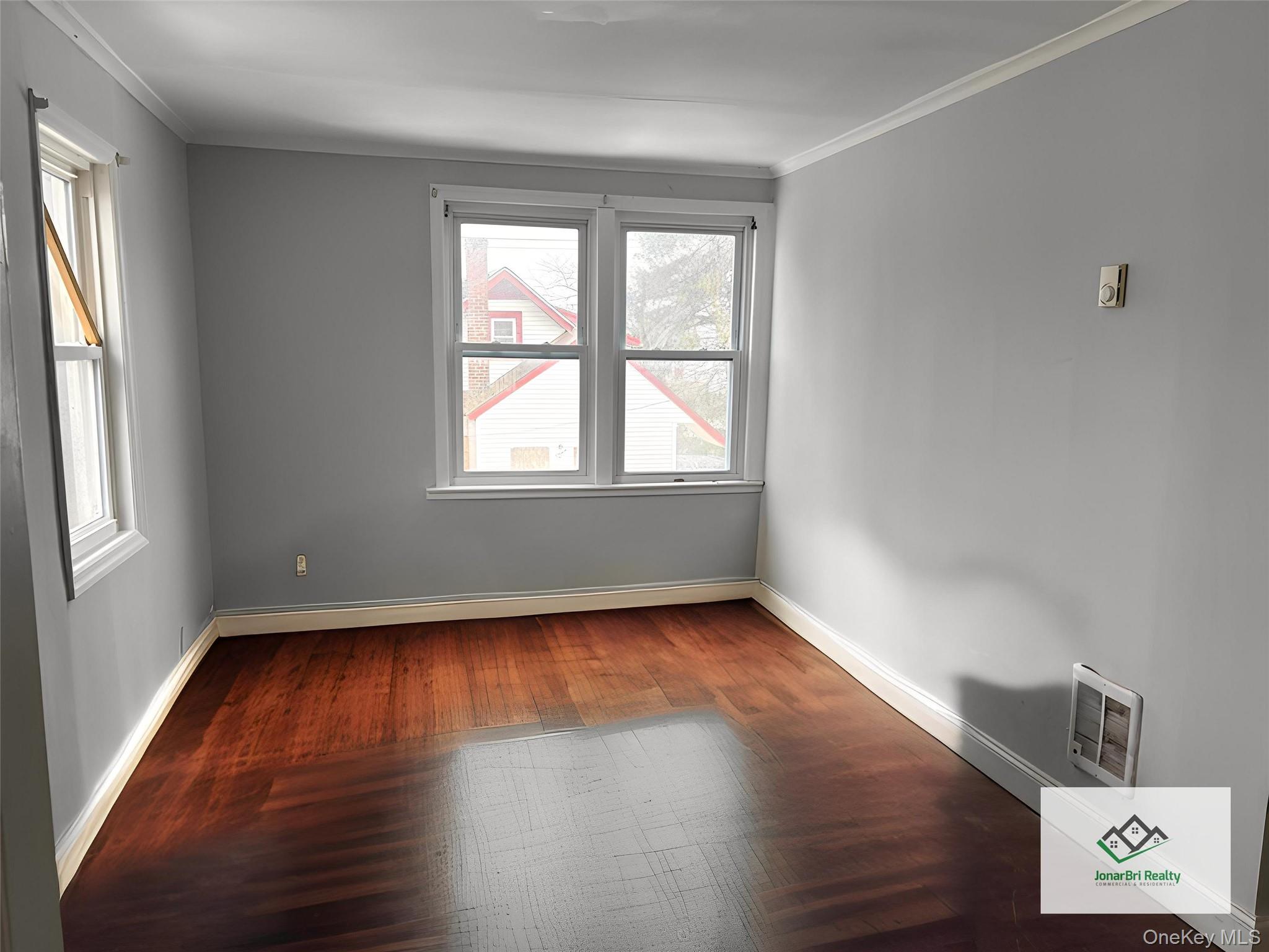 #12 photo, 21 E Clinton Avenue, Roosevelt , NY 11575